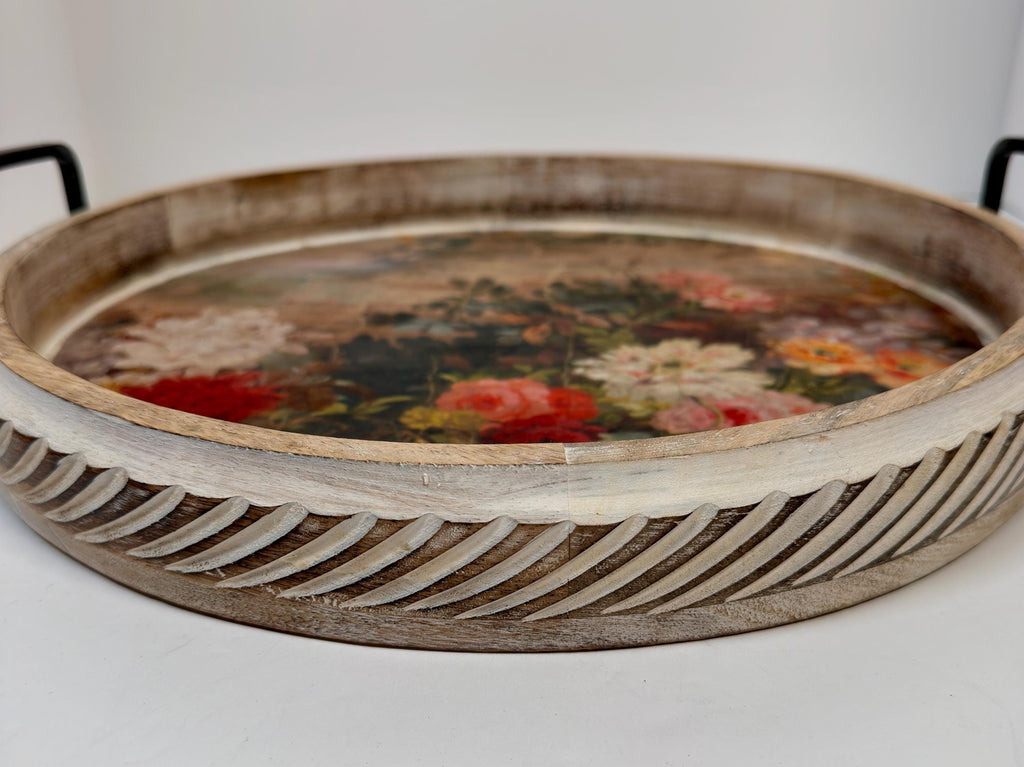 A wooden tray with a floral design on the surface, featuring a variety of colorful flowers.