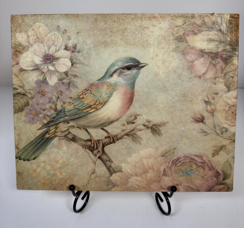 a painting of a colorful bird perched on a branch, surrounded by flowers and foliage.