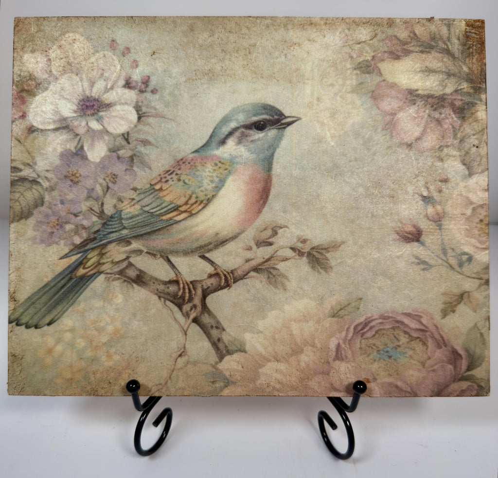 a painting of a colorful bird perched on a branch, surrounded by flowers and foliage.