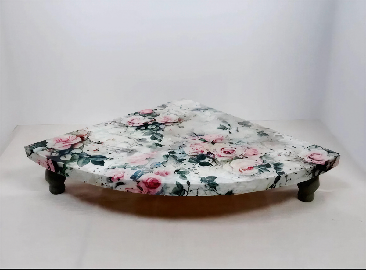 a decorative table with a floral pattern on its surface.
