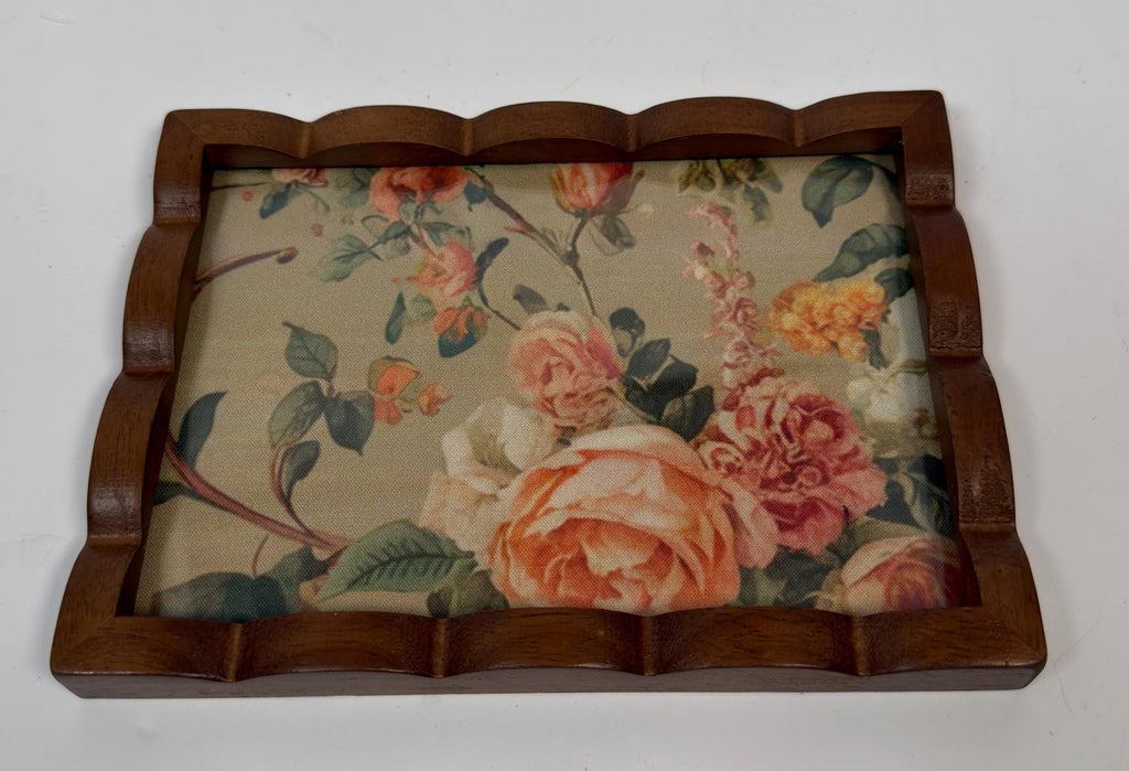 a wooden frame with a floral pattern on the inside, which appears to be a decorative piece.