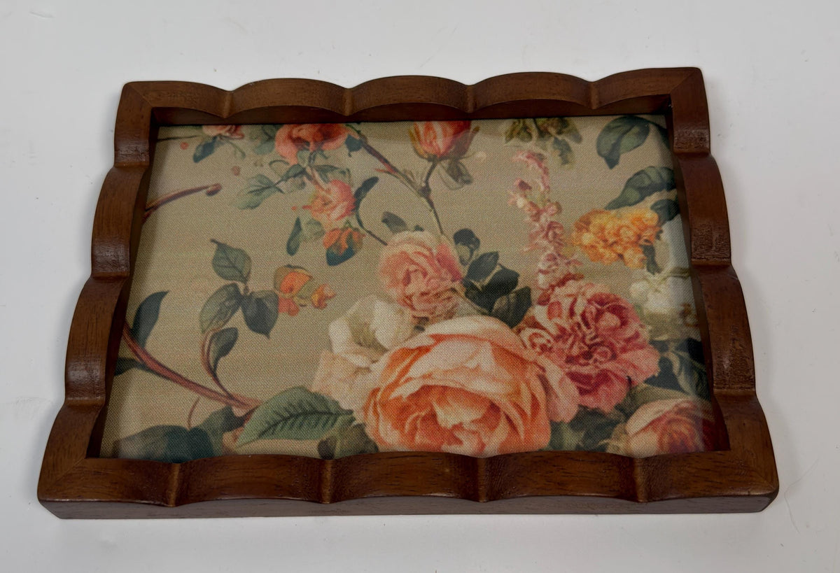 a wooden frame with a floral pattern on the inside, which appears to be a decorative piece.