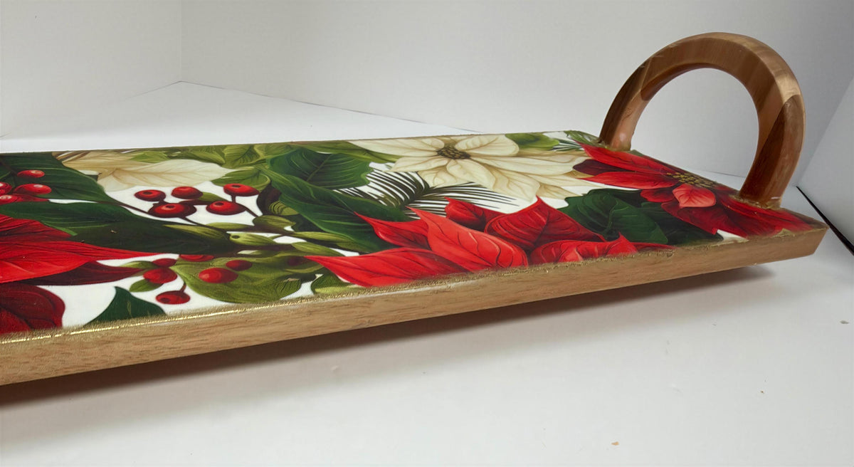 a wooden tray with a vibrant floral pattern on its surface.