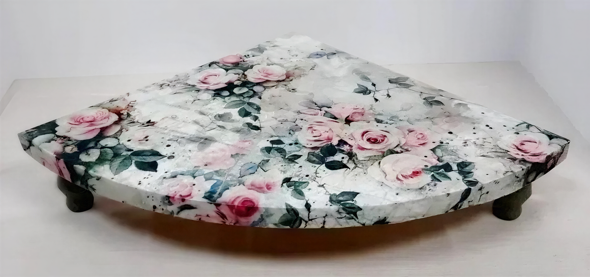 a decorative table with a floral pattern on its surface.