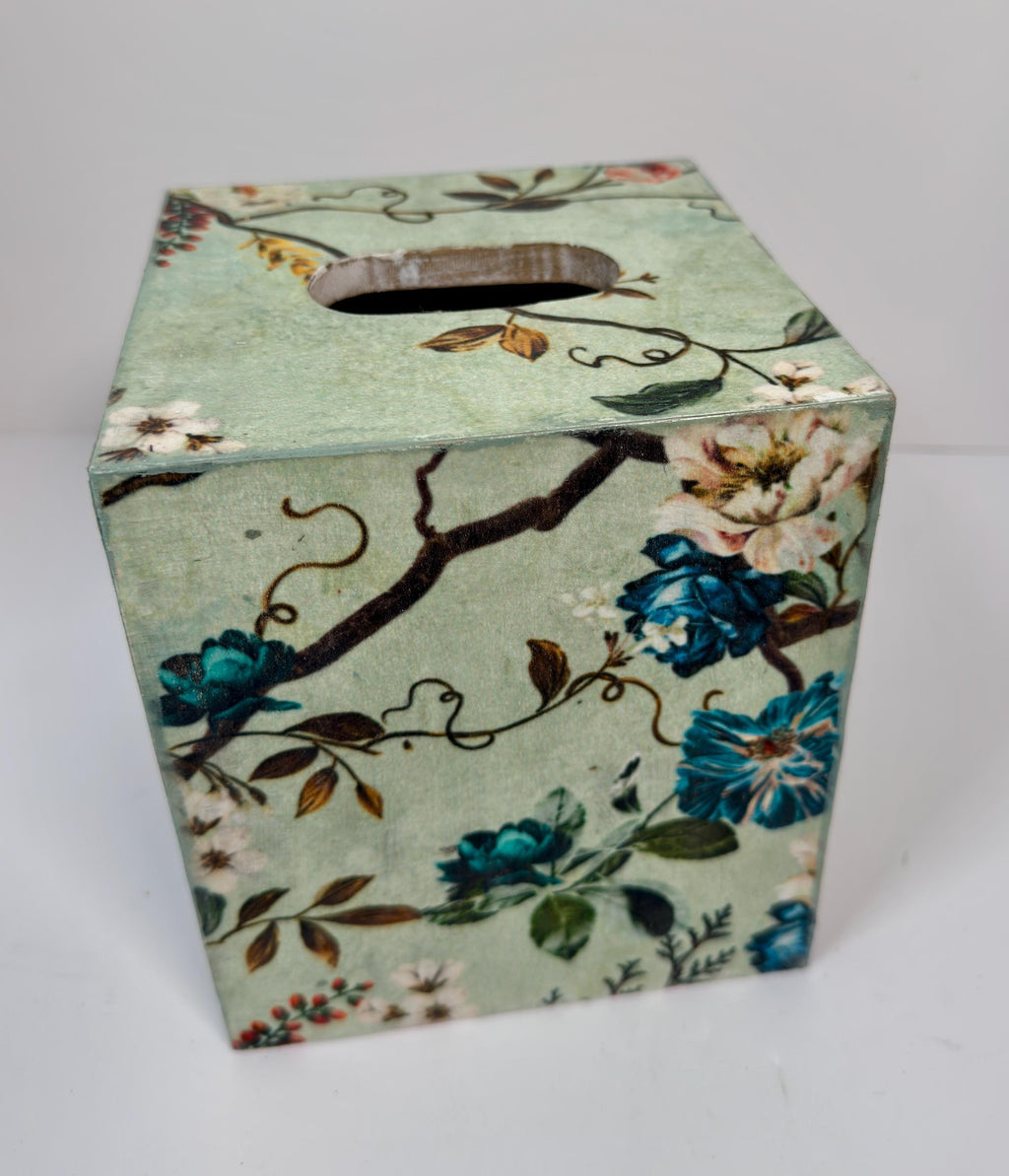 a square-shaped box with a floral pattern on its surface.