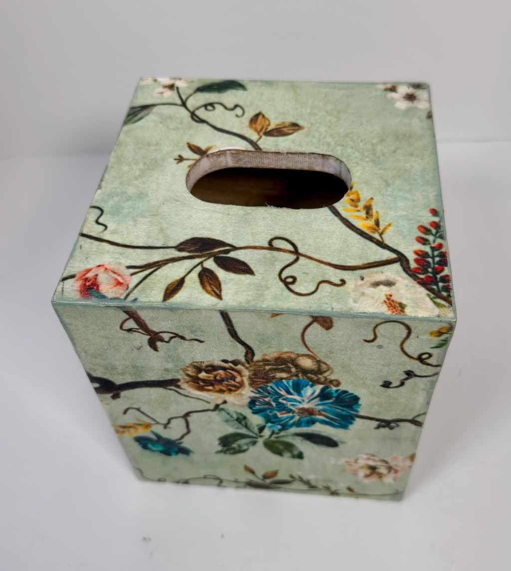 a square-shaped box with a floral pattern on its surface.