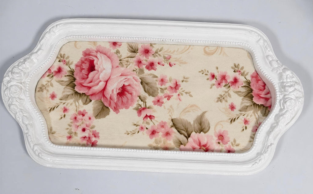 A white tray with a floral pattern on it.
