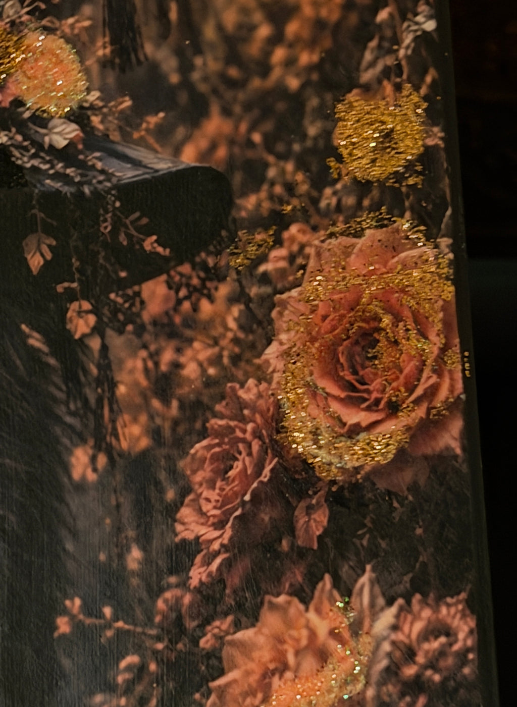 a close-up view of a vibrant bouquet of pink and orange flowers, with a touch of gold glitter adding a sparkle to the arrangement.