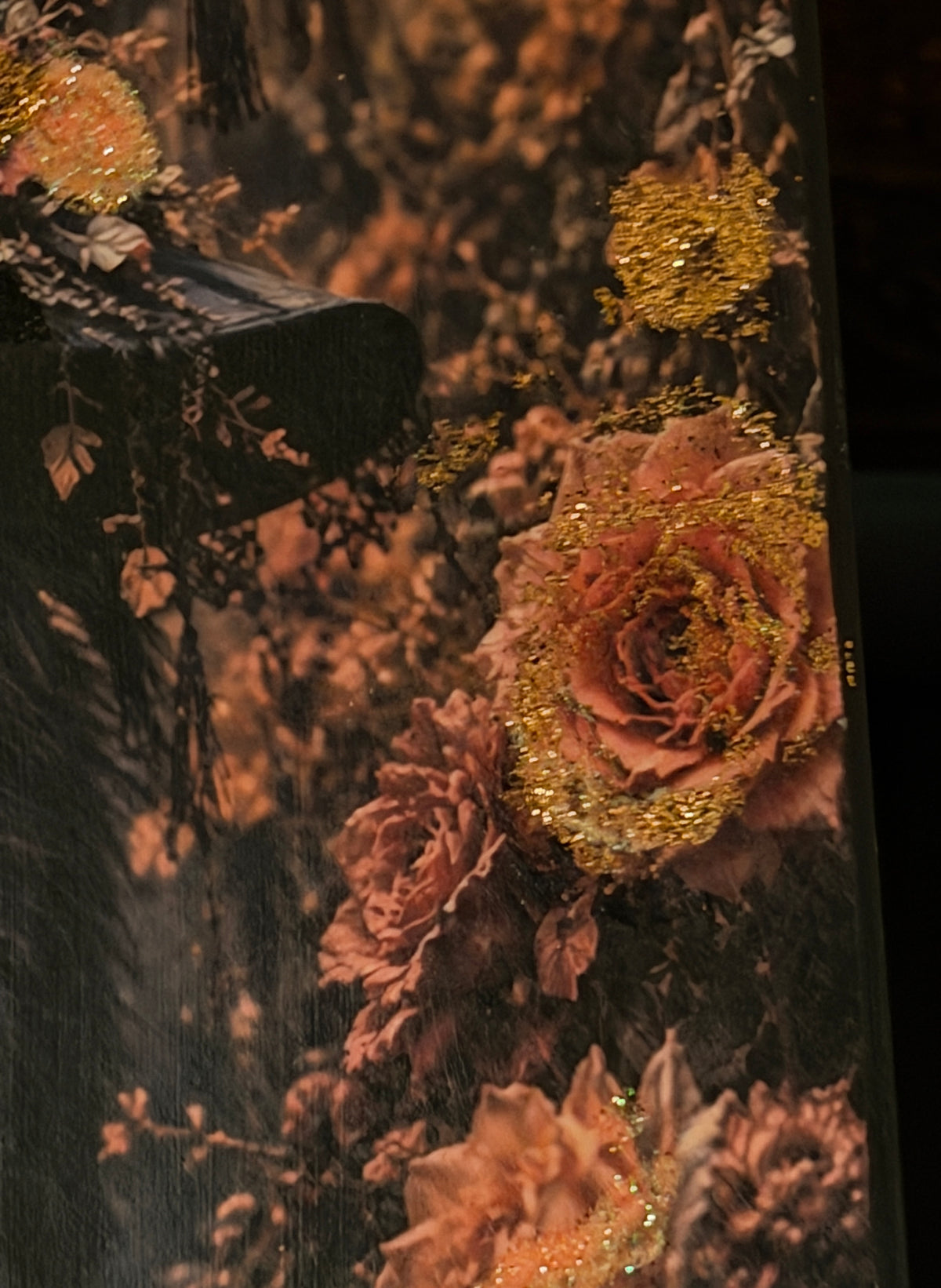 a close-up view of a vibrant bouquet of pink and orange flowers, with a touch of gold glitter adding a sparkle to the arrangement.