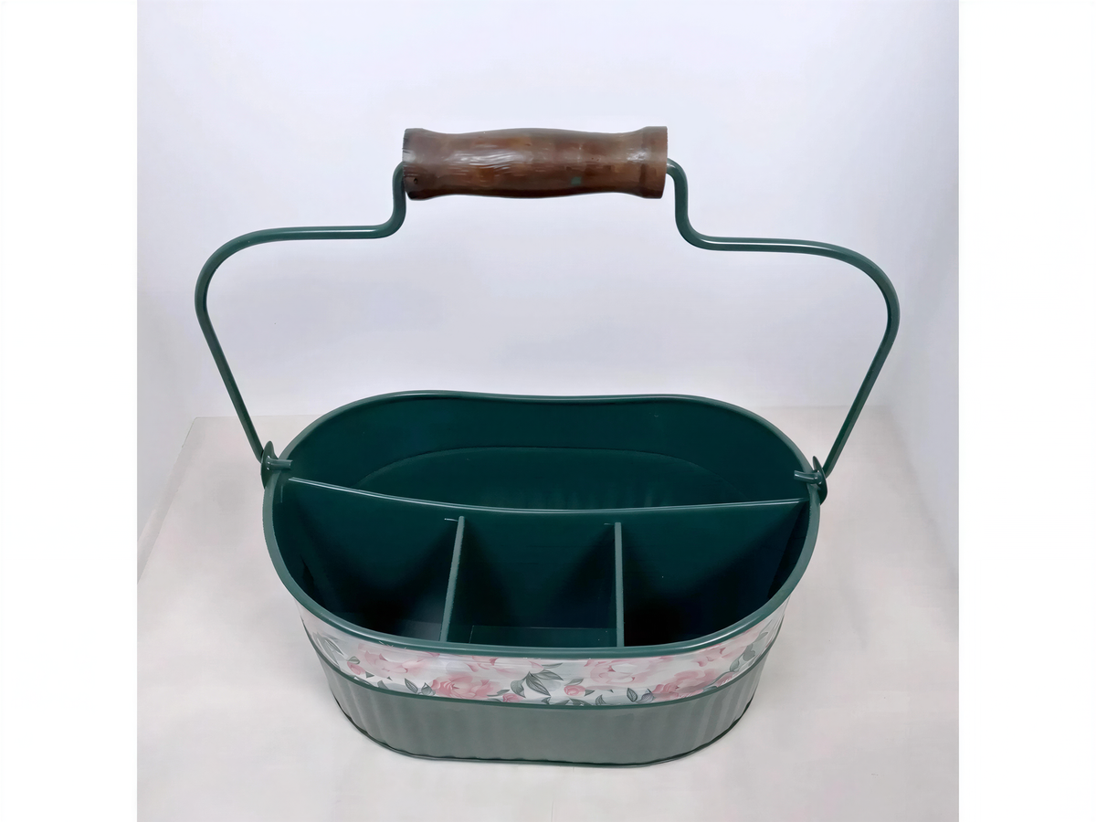 A green metal basket with a wooden handle, designed to hold small items or objects.