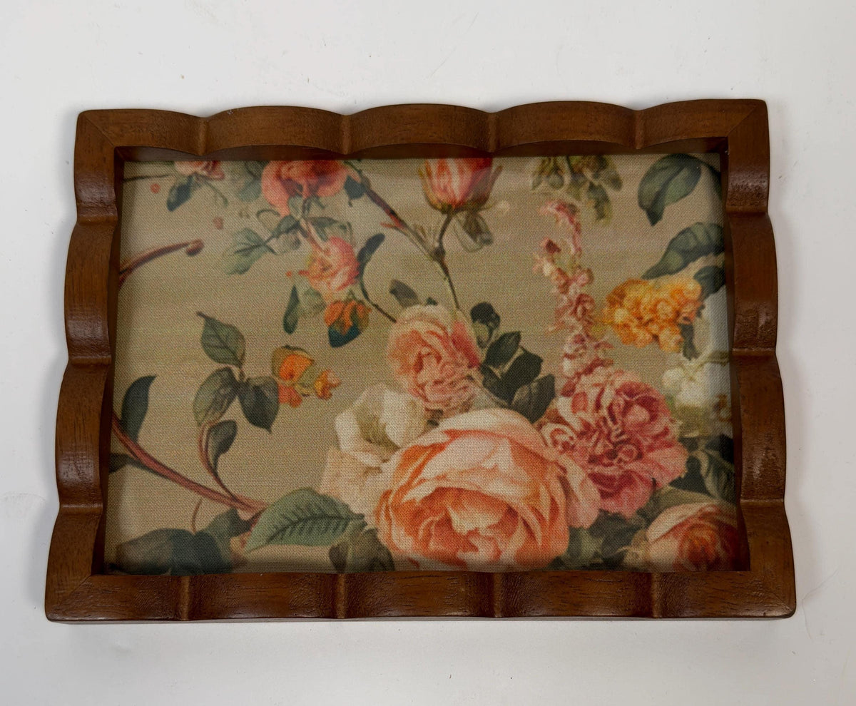 a wooden tray with a floral pattern on it.