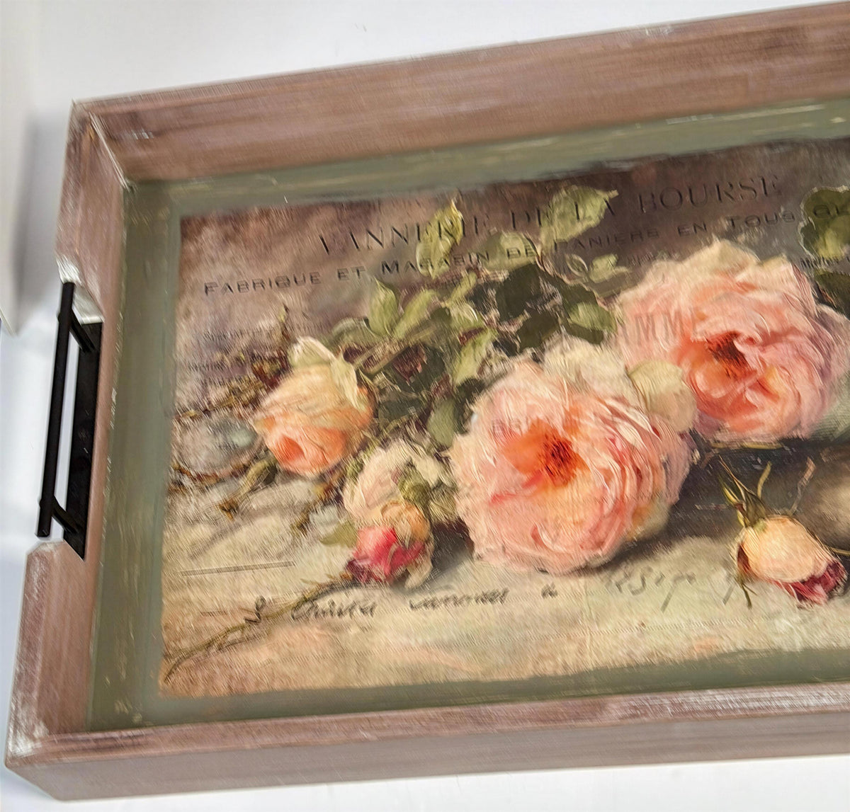 a wooden tray with a painting of pink roses on it.