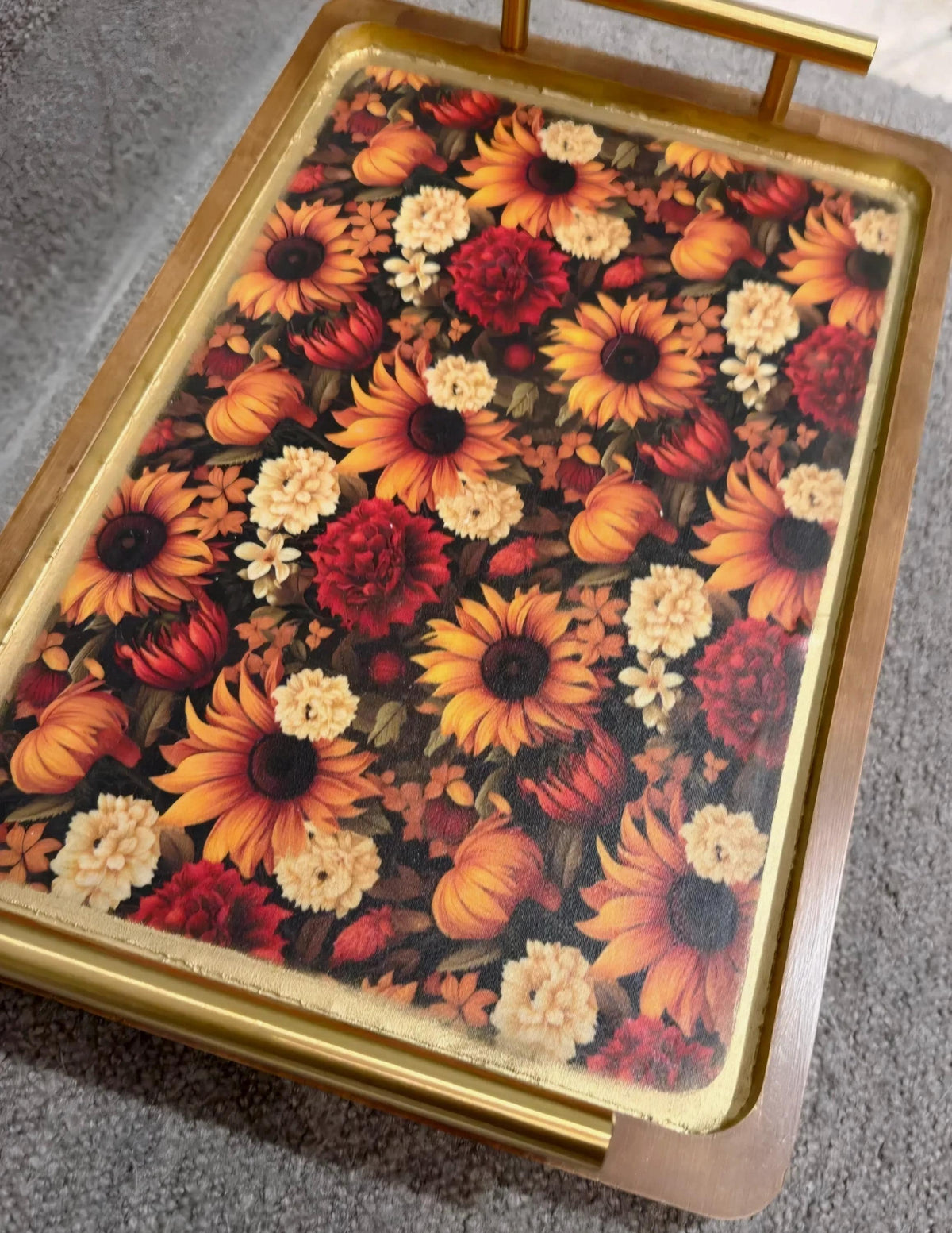 a decorative tray with a floral pattern on it.