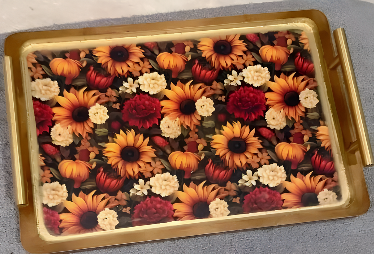 a rectangular tray with a gold frame, displaying a vibrant and colorful arrangement of sunflowers and other flowers.