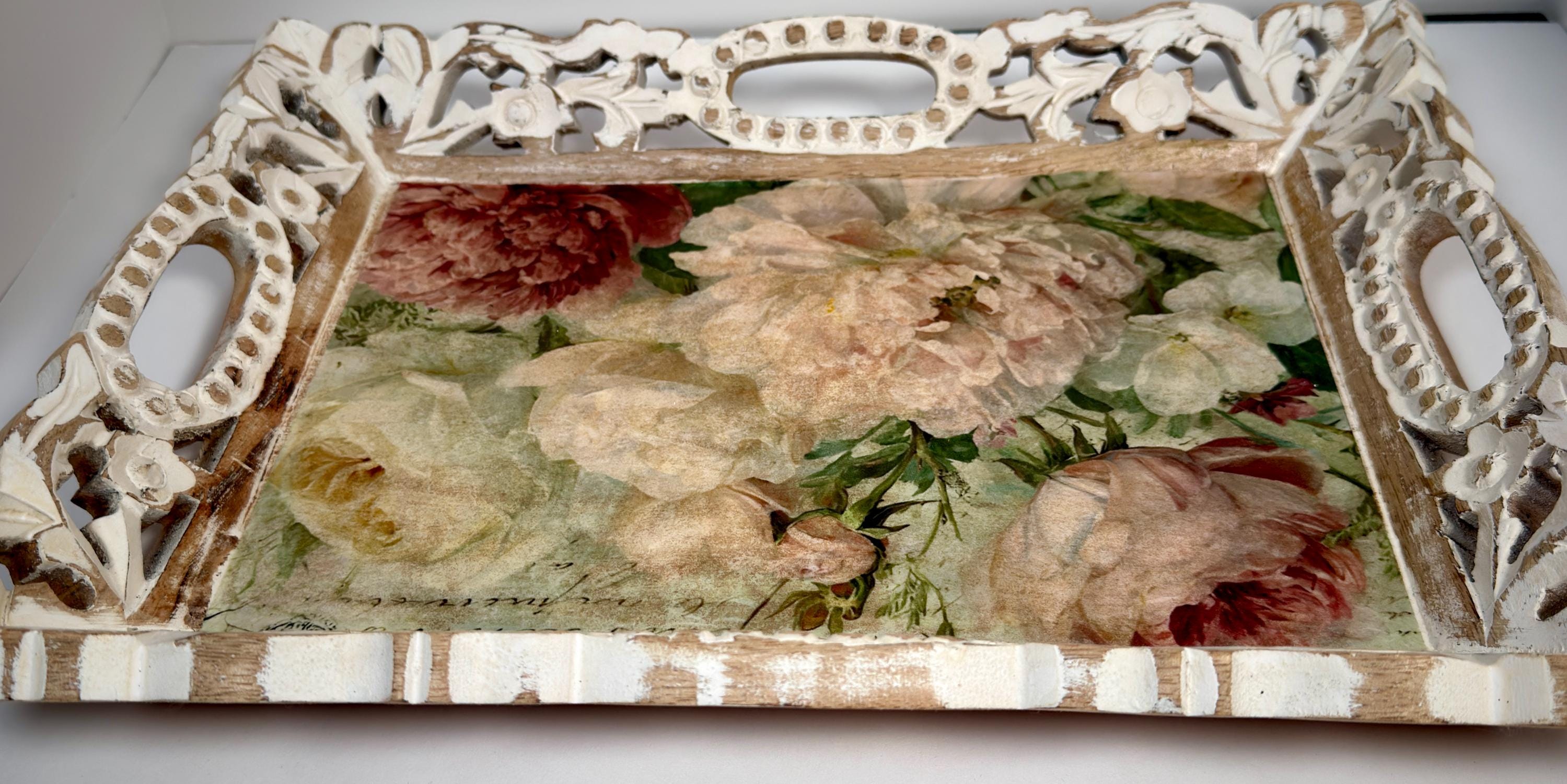 a decorative tray with a floral design on it.