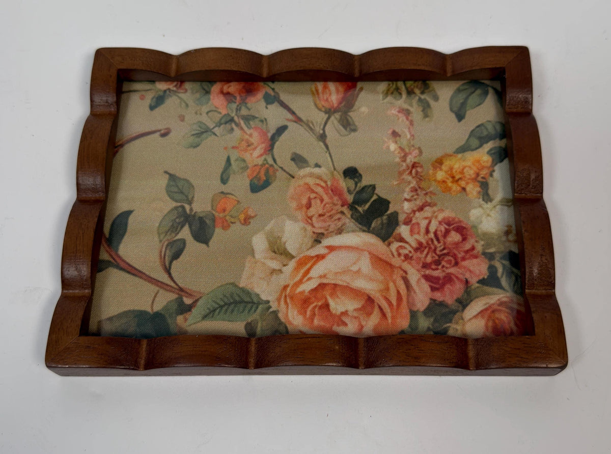 a wooden frame with a floral pattern on the fabric inside.